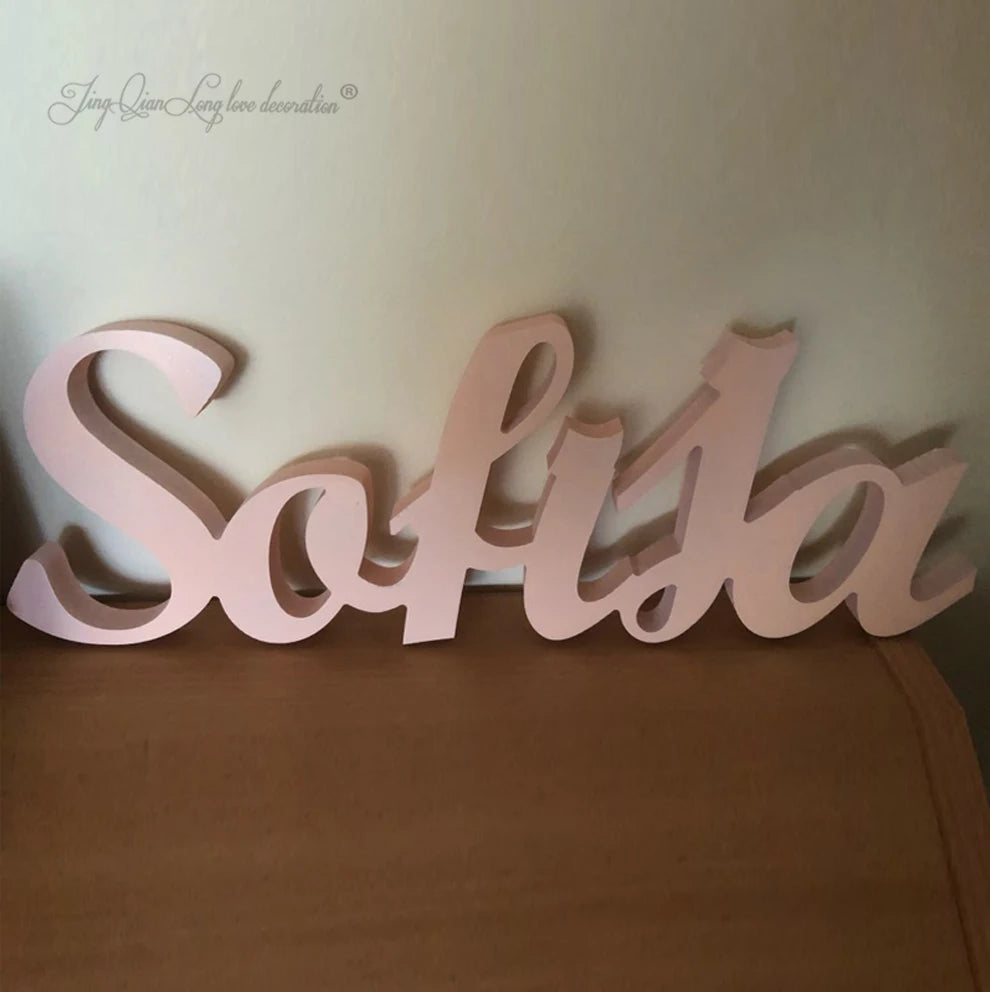 Personalized baby name plaque wall hanging wooden art above a bed custom children’s