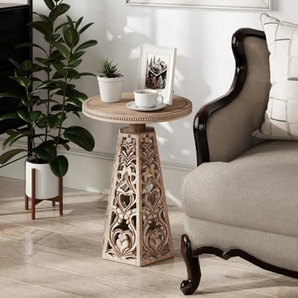 Vintage-style round wooden side table with detailed carved flowers suitable for bohemian living room decor - distressed