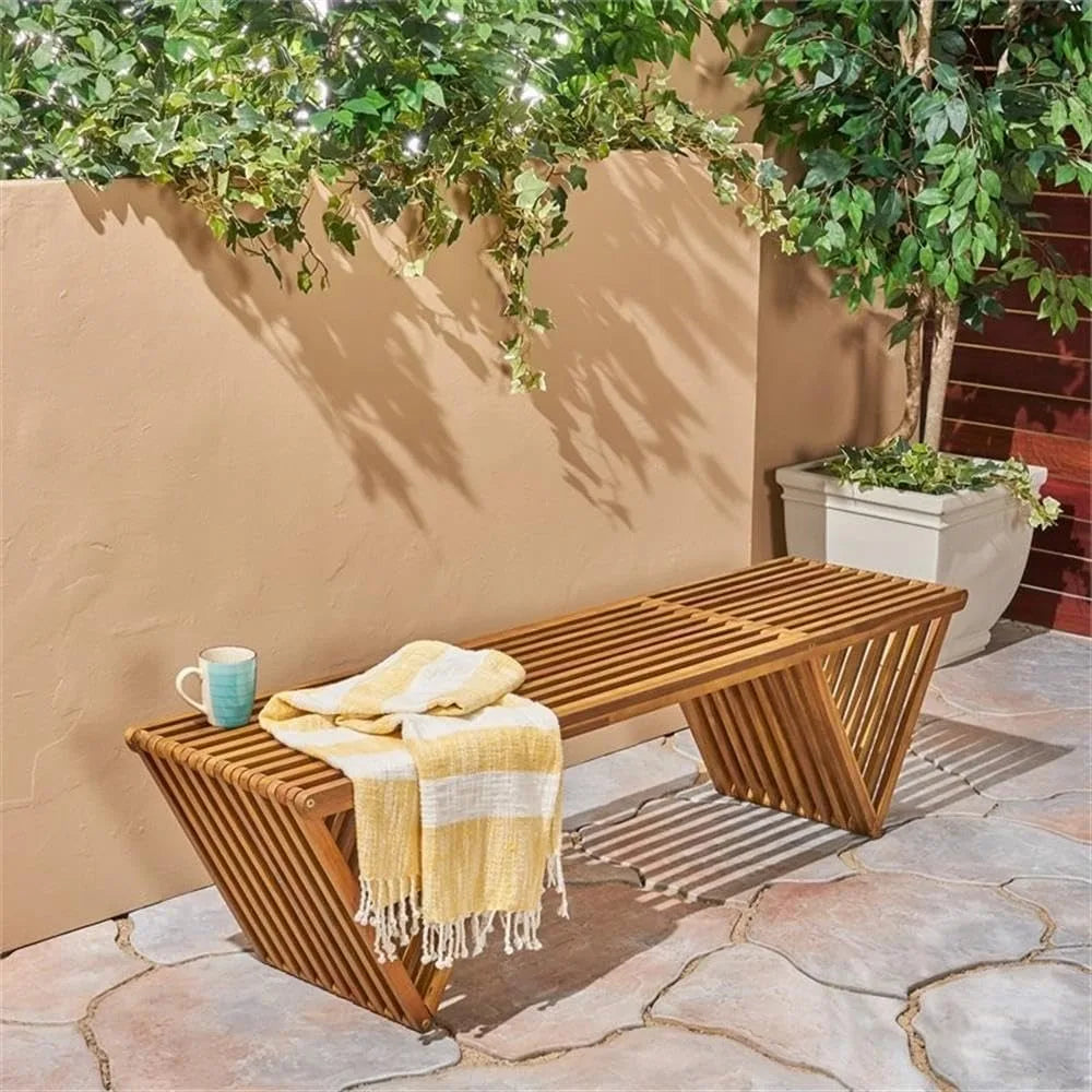 Esme outdoor acacia wood bench teak finish brown outdoor benches are placed in the garden 17.75’’d x 63’’w 16.5’’h