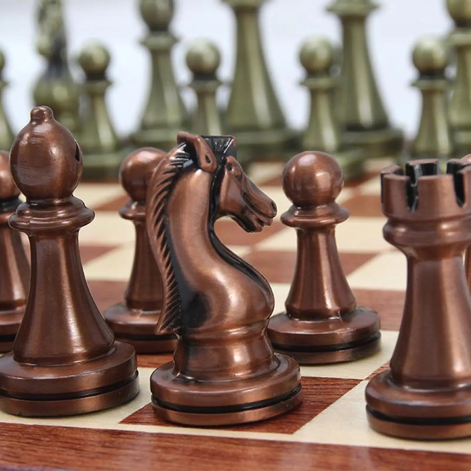 Elegant metal chess set with folding chessboard storage board