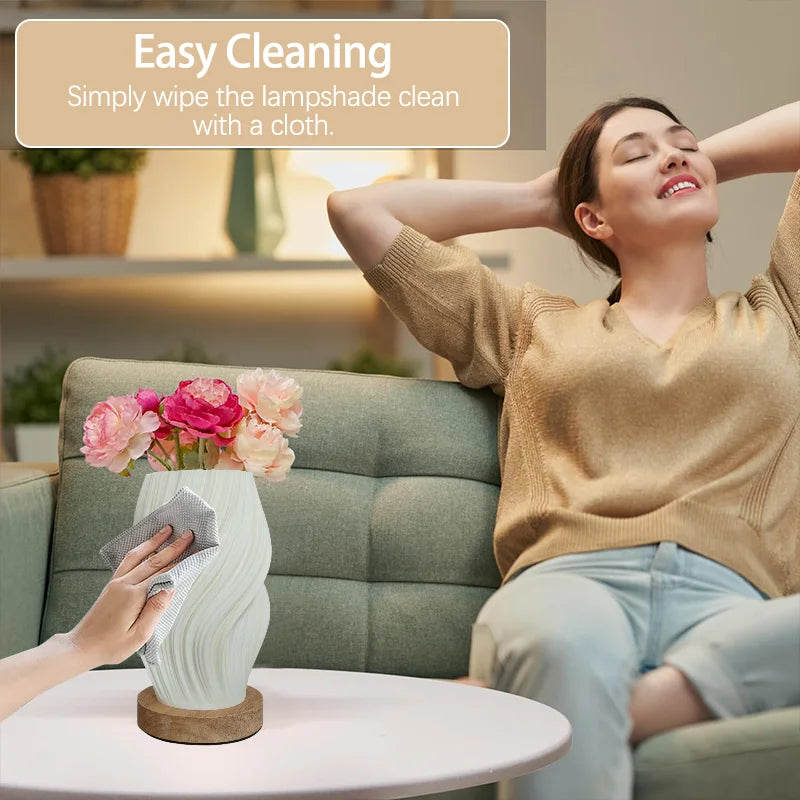 Modern minimalist cream-colored table lamp with wooden base featuring three adjustable color temperatures. Ideal