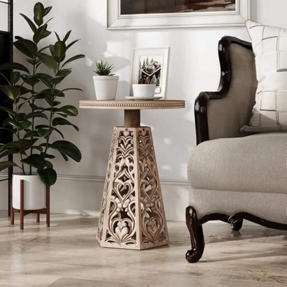 Vintage-style round wooden side table with detailed carved flowers suitable for bohemian living room decor - distressed